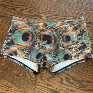 Onzie peacock feather print shorts